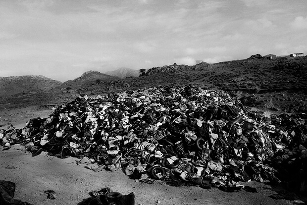 Abandoned: A more than 12ft high pile of life-jackets and dinghies, left behind by migrants and refugees that have successfully made the hazardous journey across the Mediterranean to the Greek island of Lesbos