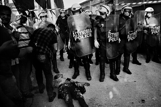 Greek police forces used tear gas on refugees a several times as they were protesting against the living conditions at the camp in Moria as well as the long waiting hours at the camp`s office for registration. A former detention center for migrants serves as the biggest refugee camp in the village of Moria on the island of Lesbos Greece. It holds over a thousand of refugees from Afghanistan, Iran and Somalia that are waiting for their transit papers to continue their journey to Athens. Food, water and shelter supplies are not sufficient since the flood of refugees entering Greece through the Aegean coast is wearing off the island`s capacities. Violence between the different nationalities and police forces is a daily routine.